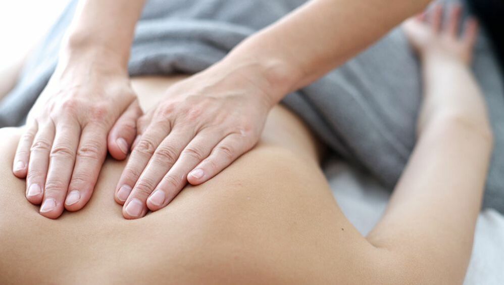 A Person Doing a Back Massage to Another